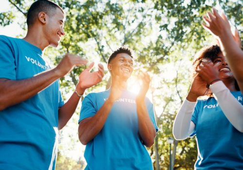 Volunteer,,Team,And,People,Clapping,For,Success,,Donation,Goal,And